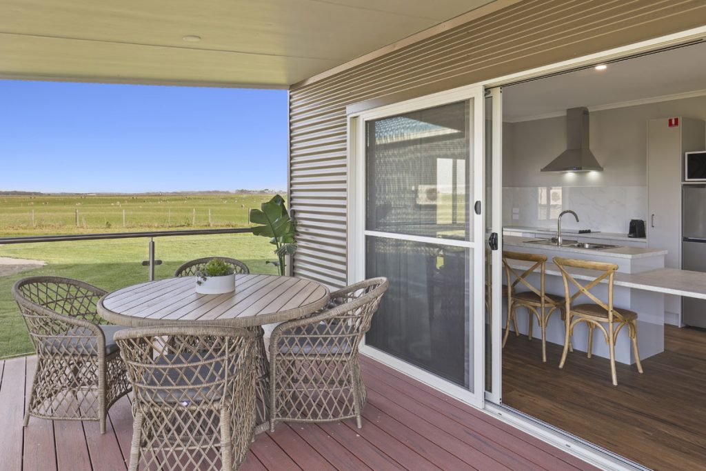 Balcony verandah area and interior kitchen view from one of Kilsby Sinkhole's beautiful villas, with scenic farmland in the background. All this, just 10 minutes from Mount Gambier.